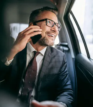 Luxury car at airport terminal for professional airport transfer service